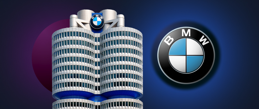 A striking BMW logo on a building, set against a bright blue backdrop, representing the brand's presence in the stock market.