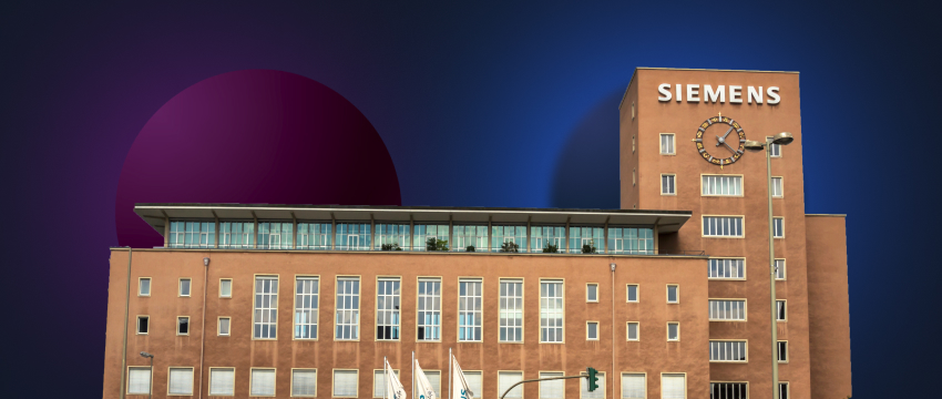 Large Siemens headquarters building featuring a prominent clock on its facade.