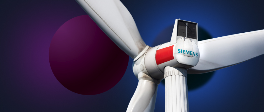 Close-up of a wind turbine against a purple and blue background, featuring the Siemens logo for a renewable energy company.